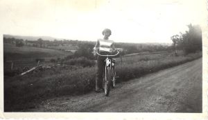 Gene Robinson Riding a bike, East Warren, 1930s