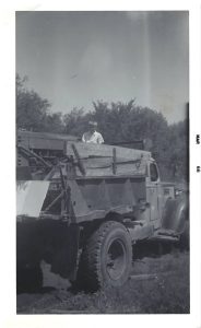 Lenord Robinson's work truck with one of his children in the back, 1966.