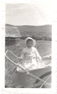 Child in a stroller, East Warren.