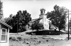 A view looking south toward the Warren Village Church.